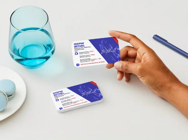 Hand holding a Bethel Church business card designed by Surge