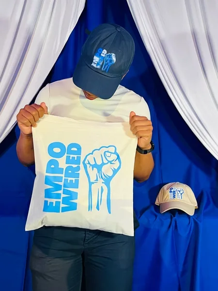 Empowered tote bag and cap set designed by Surge