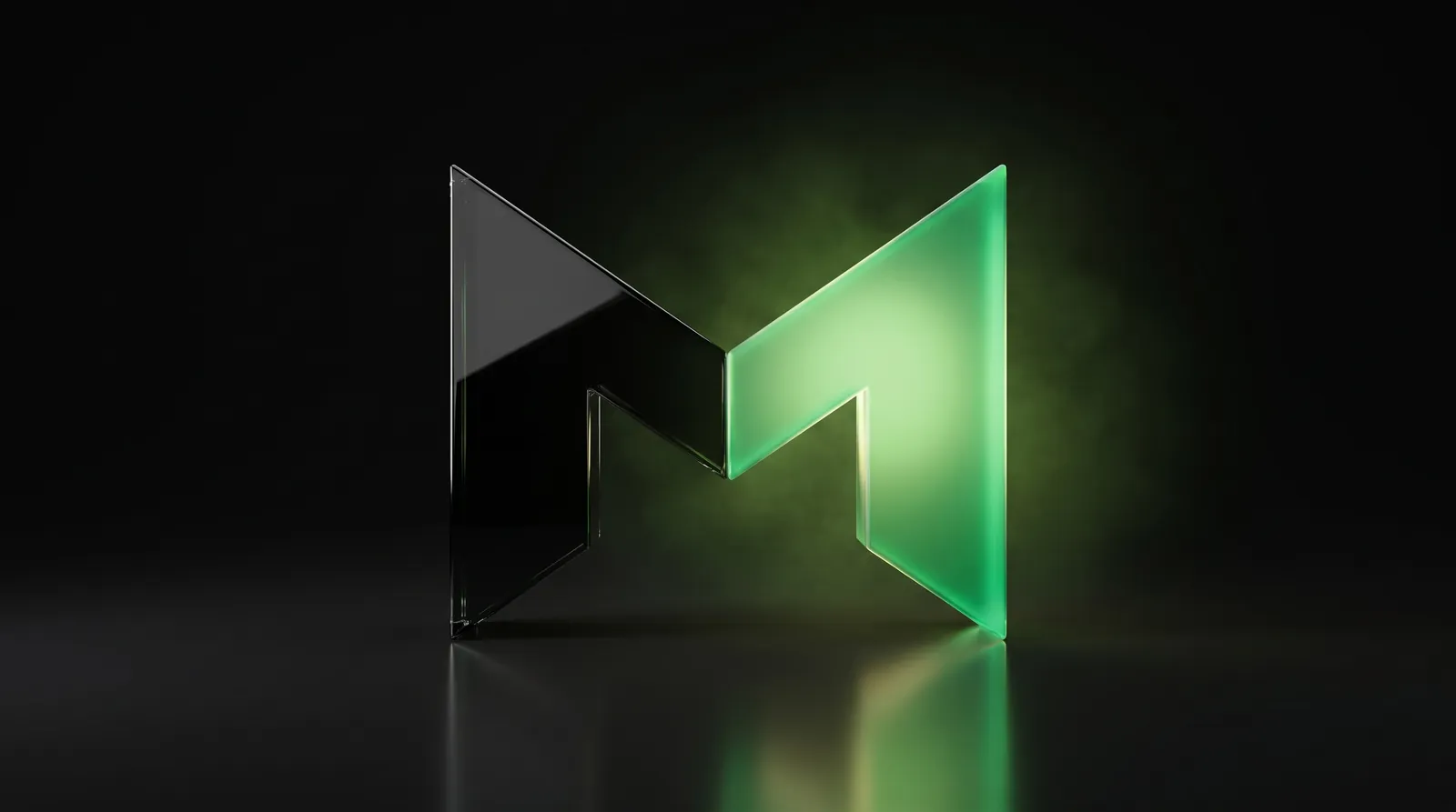 The Surge M logo in glass, lit green on black